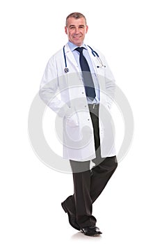 Relaxed mature doctor on a white background