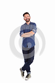 Relaxed mature man standing with arms crossed