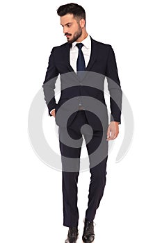 Relaxed modern business man standing with hand in pocket