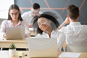 Relaxed smiling african woman enjoying break in coworking, no st