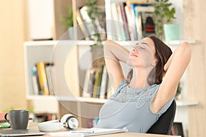 Relaxed student resting on a chair at home