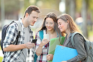 Relaxed students watching phone content outside