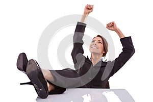 Relaxed and winning business woman sitting