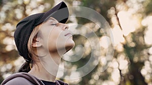 Relaxed woman breathing fresh air outdoors