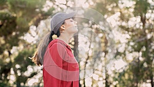 Relaxed woman breathing fresh air outdoors