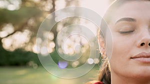 Relaxed woman breathing fresh air outdoors