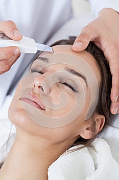 Relaxed woman during cavitation peeling