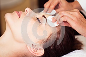 Relaxed woman with a deep cleansing nourishing face mask applied