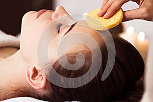 Relaxed woman with a deep cleansing nourishing face mask applied