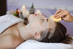 Relaxed woman with a deep cleansing nourishing face mask applied