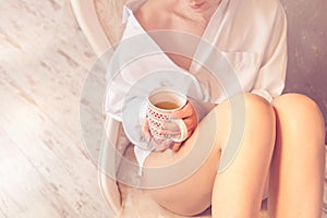 Relaxed woman drinking a tea at home