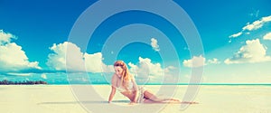 Relaxed woman enjoying tropical sandy beach and Caribbean summer vacation