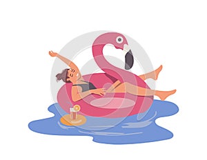 Relaxed woman floating in rubber swan ring drinking cocktail while rest in swimming pool or sea