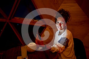 Relaxed woman inside a dome tent.