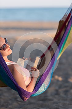 Relaxed woman laying in hammock