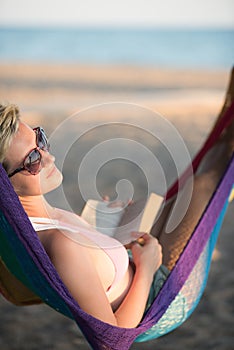 Relaxed woman laying in hammock