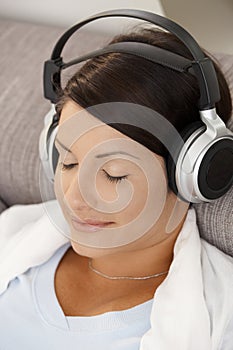 Relaxed woman listening music