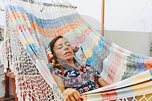 Relaxed woman, napping on hammock. Relaxing tranquility on summer vacation