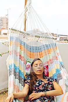 Relaxed woman, napping on hammock. Relaxing tranquility on summer vacation