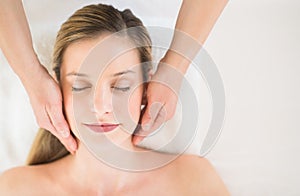 Relaxed Woman Receiving Head Massage In Health Spa