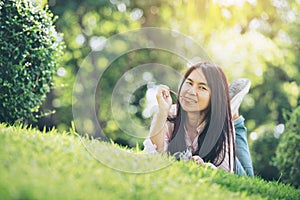 Relaxed Young Beautiful Woman With Smiling Face Enjoy Eating Pork Stick In The Park