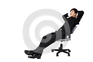 Relaxed young businessman sitting on the chair