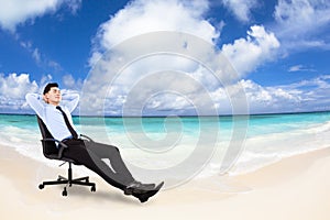 Relaxed Young businessman sitting in chair