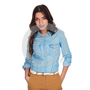 Relaxed young casual woman with hands in pockets