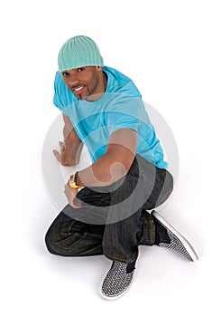 Relaxed young man sitting on the floor