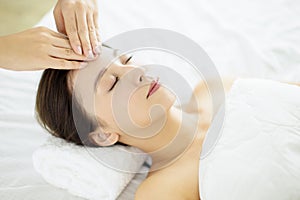 Relaxed Young woman enjoy massage in spa salon