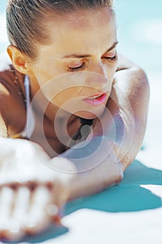 Relaxed young woman laying at seaside