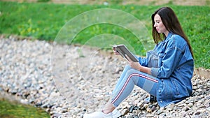 Relaxed young woman reading book