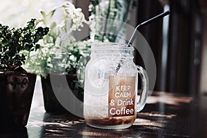 Relaxing atmosphere in a coffee shop, glass of iced cold coffee