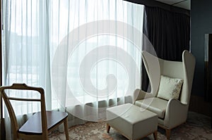 Relaxing corner armchair in hotel accommodation bedroom