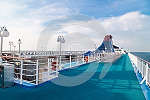 Relaxing cruise ship deck against blue sky and ocean