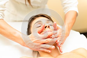 A relaxing facial massage performed by a professional