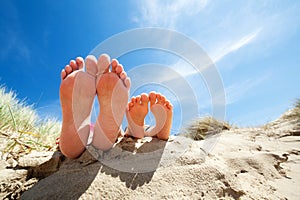 Relaxing feet on the beach