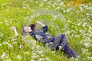 Woman relaxing flower field photo