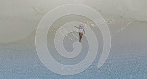 Relaxing lifestyle young woman lying and sunbathing on the beach