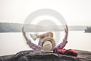 Relaxing moment Asian boy backpacker in nature