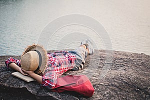 Relaxing moment Asian boy backpacker in nature