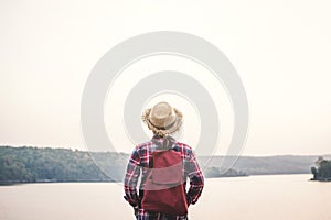 Relaxing moment Asian boy backpacker in nature