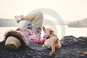 Relaxing moment Asian boy and dog in nature