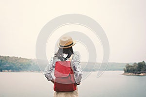 Relaxing moment Asian girl backpacker in nature