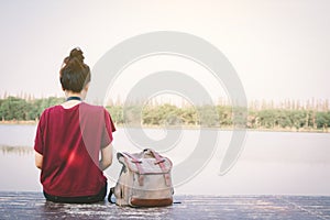 Relaxing moment Asian tourist rest on park