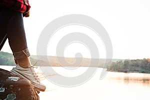 Relaxing moments, Young woman reading a book in nature background. Solo relaxation, color of Hipster Tone.