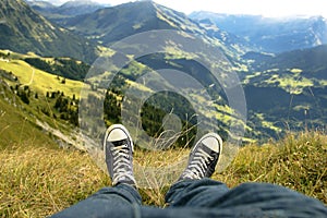 Relaxing on the mountain in Switzerland in converse