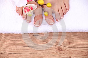 Relaxing pink manicure and pedicure with a orchid