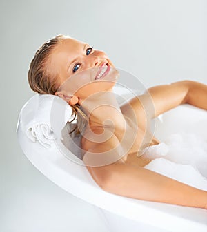 This is so relaxing. Portrait of a stunning young woman relaxed in her bubble bath.