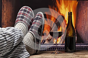 Relaxing in slippers at fireplace